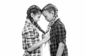 Two young girls with pig tail french braids